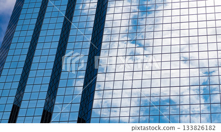 Glass exterior background. Architecture. Building exterior architecture. Building background. Glass backdrop building. Architectural detail. Background of architecture. Modern glass background Glass exterior background. Architecture. Building exterior architecture. Building background. Glass backdrop building. Architectural detail. Background of architecture. Modern glass background 133826182