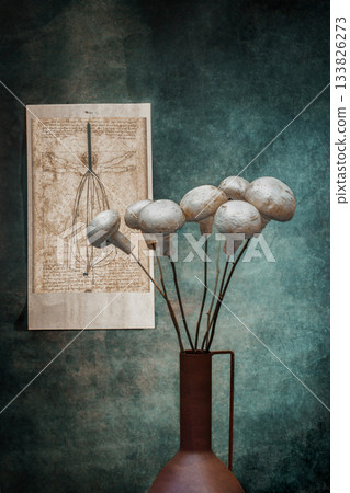 Mushrooms champignon on wooden sticks on the background of a picture by Leonardo da Vinci Mushrooms champignon on wooden sticks on the background of a picture by Leonardo da Vinci 133826273