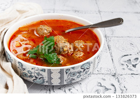 Romanian soup with meatballs, vegetable soup with meatballs, tiled table, homemade, no people, 133826373