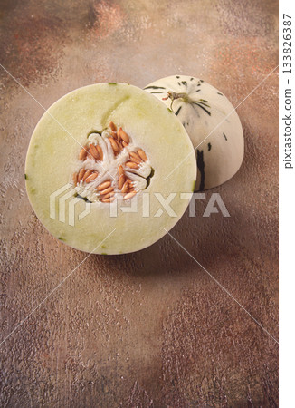 Dino melon, cut, on the table, top view, no people, 133826387