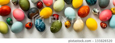 A collection of Easter eggs in bright colors and patterns is displayed on a light surface, capturing the festive spirit of Easter celebrations and springtime joy, banner A collection of Easter eggs in bright colors and patterns is displayed on a light surface, capturing the festive spirit of Easter celebrations and springtime joy, banner 133826520