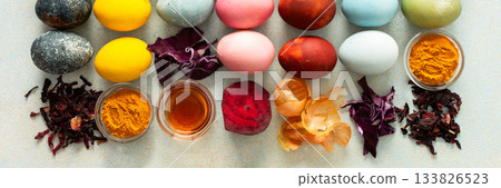 Brightly colored Easter eggs , showcasing various hues created from natural dye sources. Fresh ingredients are displayed alongside such as beets, turmeric and hibiscus, cabbage and onion peel, vinegar Brightly colored Easter eggs , showcasing various hues created from natural dye sources. Fresh ingredients are displayed alongside such as beets, turmeric and hibiscus, cabbage and onion peel, vinegar 133826523