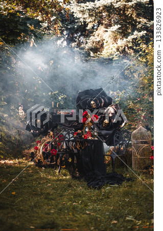 Gothic Outdoor Tea Party with Black Roses and Skull 133826923