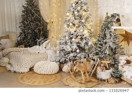 Cozy Scandinavian Christmas kids room with snowy trees, lights and wooden toys 133826947