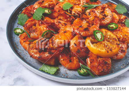 grilled shrimp, unpeeled, headless, with spices, on a marble table, homemade, no people, grilled shrimp, unpeeled, headless, with spices, on a marble table, homemade, no people, 133827144