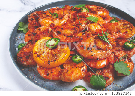 grilled shrimp, unpeeled, headless, with spices, on a marble table, homemade, no people, 133827145