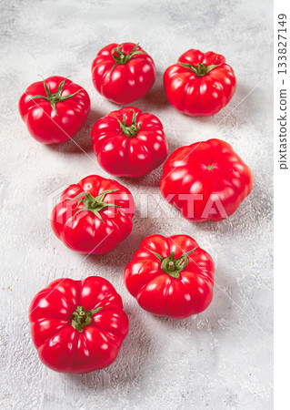 pink tomatoes scattered on the table, top view, close-up, no people, 133827149