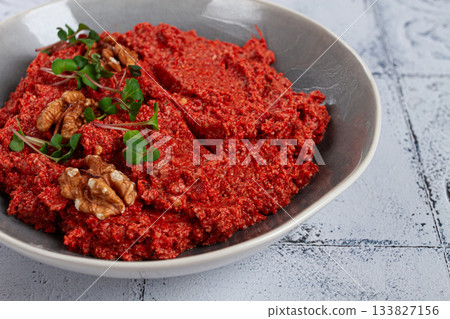 Mahammara red pepper sauce, with walnuts, and sprigs of fresh microgreens, homemade, no people, Mahammara red pepper sauce, with walnuts, and sprigs of fresh microgreens, homemade, no people, 133827156