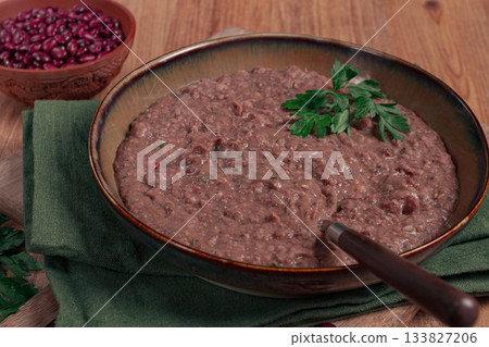 Red bean lobio,a traditional Georgian dish, on a wooden table, homemade, Red bean lobio,a traditional Georgian dish, on a wooden table, homemade, 133827206