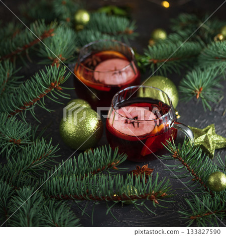 Two Glass Mugs of Mulled Wine with Christmas Decor and Fairy Lights Two Glass Mugs of Mulled Wine with Christmas Decor and Fairy Lights 133827590