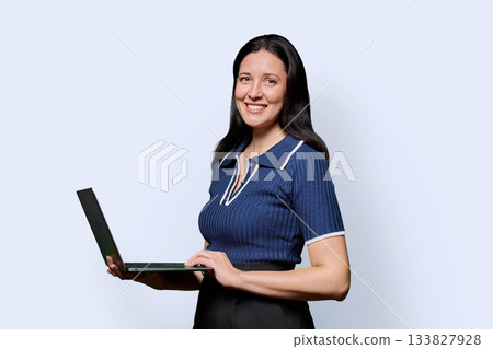 Portrait of successful middle-aged woman with laptop on white background 133827928