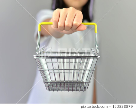 Hand holding empty chrome basket for shopping on white background Hand holding empty chrome basket for shopping on white background 133828879