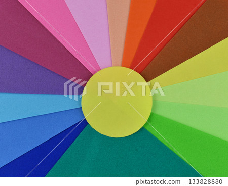 Colorful sun with stack of variety colored art paper for background Colorful sun with stack of variety colored art paper for background 133828880