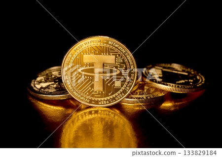 Tether USDT cryptocurrency and gold coins. 133829184