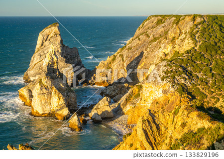 Cabo da Roca, Ursa Beach, Cliffs and Atlantic Ocean Waves at Sunset. Portugal Cabo da Roca, Ursa Beach, Cliffs and Atlantic Ocean Waves at Sunset. Portugal 133829196
