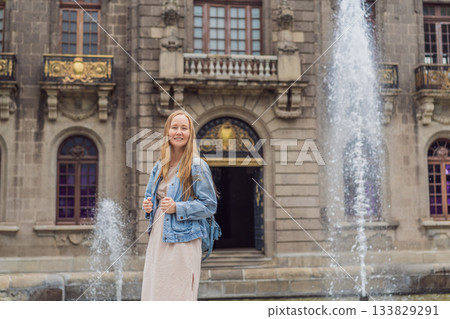 Young woman tourist standing near Chapultepec Castle in Mexico City, exploring the historic landmark. Solo travel, cultural heritage, tourism, and adventure concept Young woman tourist standing near Chapultepec Castle in Mexico City, exploring the historic landmark. Solo travel, cultural heritage, tourism, and adventure concept 133829291