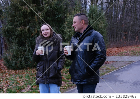drink coffee in paper cups daughter caring for father teenagers, adult communication, good family relationships, support 133829462