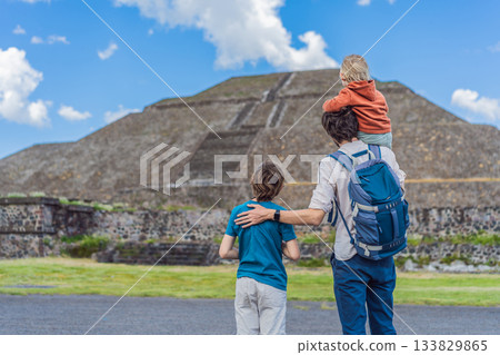 Father with his two sons as tourists in front of the pyramids of Teotihuacan, Mexico, enjoying family travel, sightseeing, and cultural heritage together Father with his two sons as tourists in front of the pyramids of Teotihuacan, Mexico, enjoying family travel, sightseeing, and cultural heritage together 133829865