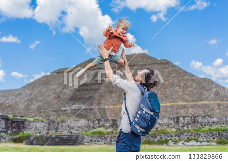 Father with his little toddler son as tourists in front of the pyramids of Teotihuacan in Mexico, enjoying sightseeing, family bonding, and cultural heritage 133829866