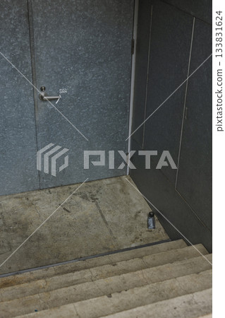 An inorganic space with iron doors and concrete stairs An inorganic space with iron doors and concrete stairs 133831624