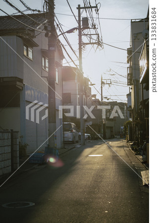 A back alley leading to a residential area in the evening A back alley leading to a residential area in the evening 133831684