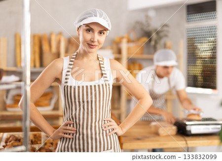 Successful female bakery owner standing with crossed arms Successful female bakery owner standing with crossed arms 133832099