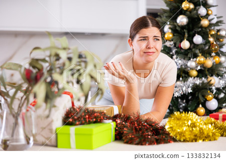 upset girl in a festive New Year s atmosphere 133832134