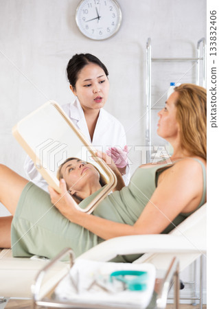 young doctor consulting with mirror young doctor consulting with mirror 133832406