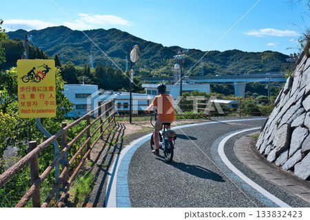 Cyclists heading for Tatara Bridge Cyclists heading for Tatara Bridge 133832423