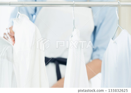 Young lady hanging laundry 133832625