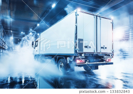 Refrigerated Truck Departing Cold Storage Warehouse at Night Refrigerated Truck Departing Cold Storage Warehouse at Night 133832843