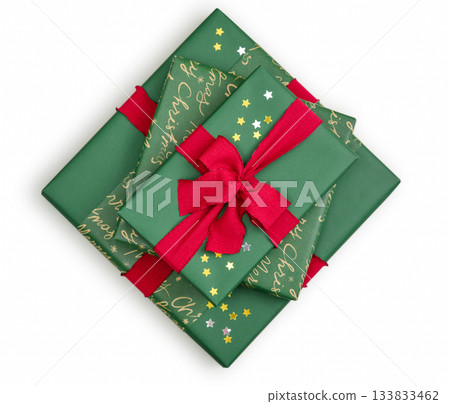 Stack of green gift boxes with red ribbon Stack of green gift boxes with red ribbon 133833462
