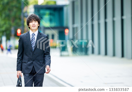 young man wearing a suit young man wearing a suit 133833587