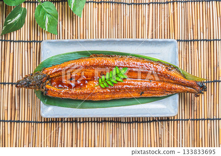 Grilled eel placed on a bamboo blind Grilled eel placed on a bamboo blind 133833695