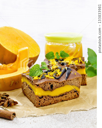 Cake chocolate with pumpkin layer on paper Cake chocolate with pumpkin layer on paper 133833981