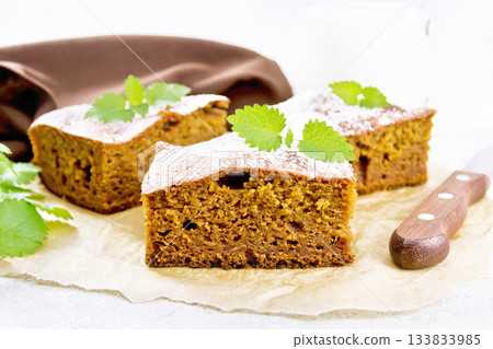 Cake pumpkin and chocolate on light stone 133833985