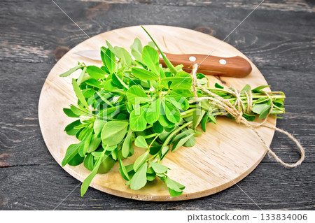 Fenugreek green on dark board 133834006