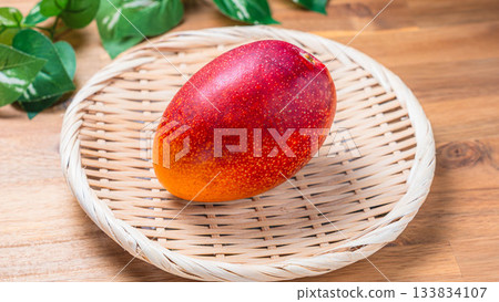 Miyazaki mangoes on a bamboo basket Miyazaki mangoes on a bamboo basket 133834107