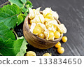 Physalis in bowl on wooden board 133834650