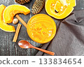 Pumpkin puree in jar on board top 133834654