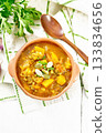 Soup-curry with pumpkin and lentils in bowl on board top 133834656