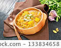 Soup-curry with pumpkin and lentils in bowl on wooden board 133834658