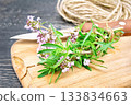 Thyme  fresh with twine on board 133834663