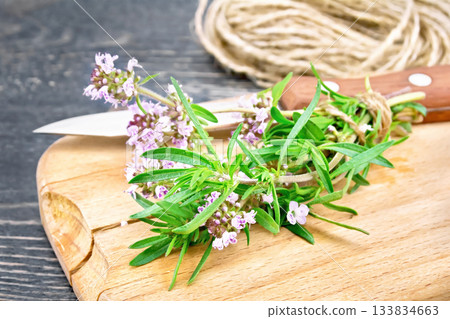Thyme fresh with twine on board Thyme fresh with twine on board 133834663