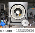 Inner view of Industrial washing machine drum. 133835939