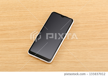 Smartphone placed on the table Smartphone placed on the table 133837012