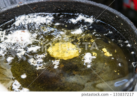 Cooking scene with deep-frying oil Cooking scene with deep-frying oil 133837217