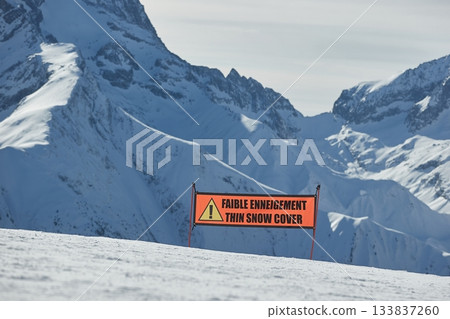 Ski warning sign for lack of snow, thin snow cover Ski warning sign for lack of snow, thin snow cover 133837260