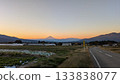 A view of the sunset sky, mountains, farm roads and Mt. Fuji 133838077