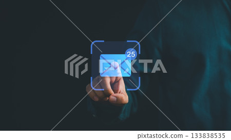 Hand pressing digital email icon with notification symbol, representing new messages, online communication, inbox management, business correspondence, and modern technology in digital networking. 133838535